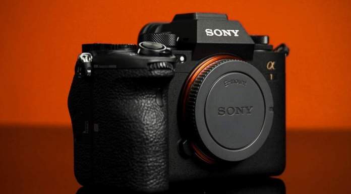 Shooting a Product Video at Home Product Shot of the Sony a1 taken on a black plexi with orange backdrop.